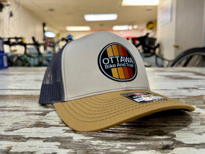 First In Apparel Shop Merch Cream Ottawa Bike and Trail Logo Trucker Hat