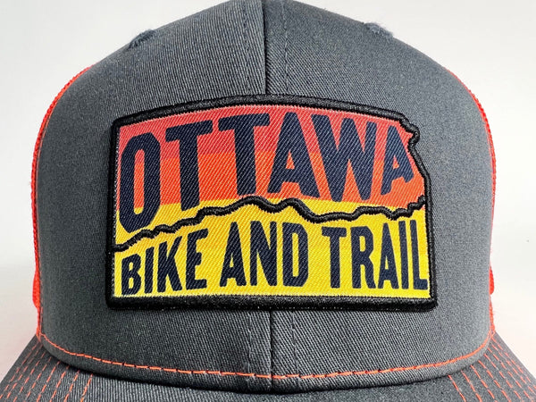 Ottawa Bike and Trail, LLC Shop Merch OBAT Logo Sunrise Trucker Hat